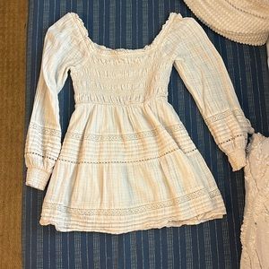 AE Ivory long sleeve babydoll dress with cinch and crochet details